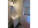 Bathroom featuring a white vanity with mirror, and light fixture with a view of the bedroom at 6102 Highcastle Ct, Raleigh, NC 27613