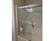 Bathroom featuring a glass enclosed shower over tub and fixtures at 6102 Highcastle Ct, Raleigh, NC 27613