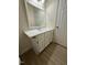 Bathroom vanity with modern faucet and a large mirror at 6102 Highcastle Ct, Raleigh, NC 27613