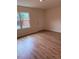 Bedroom with light colored floor and walls, plus a double window at 6102 Highcastle Ct, Raleigh, NC 27613