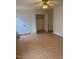 Bedroom with hardwood floors, closet, ceiling fan, and ample natural light creates a cozy and inviting atmosphere at 6102 Highcastle Ct, Raleigh, NC 27613