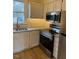 Beautiful kitchen with stainless steel appliances, granite countertops, and tile backsplash at 6102 Highcastle Ct, Raleigh, NC 27613