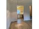 View of the kitchen with white cabinets and stainless steel appliances from living area at 6102 Highcastle Ct, Raleigh, NC 27613