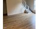Cozy living room with light-colored wood floors and a staircase with white railings at 6102 Highcastle Ct, Raleigh, NC 27613