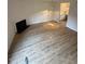 Spacious living room featuring a fireplace and modern, light-colored wood floors at 6102 Highcastle Ct, Raleigh, NC 27613