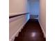 Stairway featuring white trim and wood steps at 6102 Highcastle Ct, Raleigh, NC 27613
