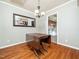 Dining room with hardwood floors, light gray walls, and a chandelier at 6469 New Market Way, Raleigh, NC 27615