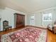 Spacious living room with hardwood floors, neutral walls, and bright natural light at 6469 New Market Way, Raleigh, NC 27615