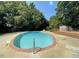 Community pool area with brick surround and wooden sundeck at 6469 New Market Way, Raleigh, NC 27615