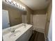 Well-lit bathroom featuring a double sink vanity and a shower-tub combo at 7036 Barlows Knoll St, Raleigh, NC 27610