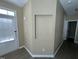 Bright entryway featuring a door to the outside, neutral walls, and stylish, modern flooring at 7036 Barlows Knoll St, Raleigh, NC 27610