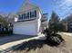 Charming two-story home with a spacious two-car garage and a well-maintained front yard, inviting and picturesque at 7036 Barlows Knoll St, Raleigh, NC 27610