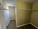 Large walk-in closet with wood-look floors and wire shelving, providing ample storage space at 7036 Barlows Knoll St, Raleigh, NC 27610