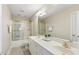 Bathroom with a double sink vanity and tub shower at 75 Morgan Dr, Lillington, NC 27546