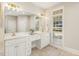 Elegant bathroom with dual sinks, a vanity area, and a large window at 75 Morgan Dr, Lillington, NC 27546