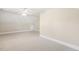 Neutral-colored attic bedroom with a door at 75 Morgan Dr, Lillington, NC 27546