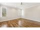 Bedroom with hardwood floors, ceiling fan and windows allowing natural light at 75 Morgan Dr, Lillington, NC 27546