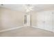Neutral bedroom with plush carpet, closet, and entrance to hallway at 75 Morgan Dr, Lillington, NC 27546
