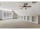 Bright bonus room featuring built-in shelving, neutral walls, and a window offering natural light at 75 Morgan Dr, Lillington, NC 27546