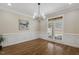 Bright dining room with hardwood floors, chair rail, and modern chandelier at 75 Morgan Dr, Lillington, NC 27546