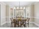 Bright dining area with windows, tile flooring, and rustic wood table at 75 Morgan Dr, Lillington, NC 27546
