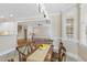 The dining room features a rustic table, tile floors, and natural light from the window at 75 Morgan Dr, Lillington, NC 27546