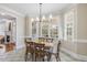 Bright dining area with windows, tile flooring, and rustic wood table at 75 Morgan Dr, Lillington, NC 27546