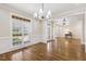 Elegant dining room featuring hardwood floors, wainscoting, and large windows at 75 Morgan Dr, Lillington, NC 27546