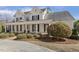 Stunning two-story home with a grand porch, white columns, and lush landscaping at 75 Morgan Dr, Lillington, NC 27546