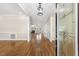 Inviting foyer with hardwood floors, view to living room, and decorative front door at 75 Morgan Dr, Lillington, NC 27546