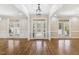 Spacious foyer with hardwood floors, transom windows, and elegant front door at 75 Morgan Dr, Lillington, NC 27546