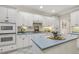 The kitchen features an island, tile floors, and white cabinets at 75 Morgan Dr, Lillington, NC 27546