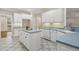 The kitchen features an island, tile floors, and white cabinets at 75 Morgan Dr, Lillington, NC 27546