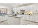 The kitchen features an island, tile floors, and white cabinets at 75 Morgan Dr, Lillington, NC 27546