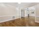 Open living space with beautiful hardwood floors, neutral walls, and views into the adjacent room at 75 Morgan Dr, Lillington, NC 27546