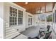 A screened-in porch with comfortable seating provides an ideal outdoor living space at 75 Morgan Dr, Lillington, NC 27546
