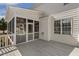 Screened porch featuring wood floors, a ceiling fan, and windows that provide plenty of light at 75 Morgan Dr, Lillington, NC 27546