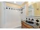 Bathroom with a shower over the tub and a black sink at 836 Canyoncreek Ln, Fuquay Varina, NC 27526