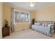 Cozy bedroom with neutral tones, a bright window, and comfortable furnishings at 836 Canyoncreek Ln, Fuquay Varina, NC 27526