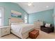 Inviting bedroom features vaulted ceiling, neutral carpet, a large window, and a cozy chair at 836 Canyoncreek Ln, Fuquay Varina, NC 27526