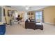 Large bonus room with comfortable seating, carpeted floor and fitness equipment at 836 Canyoncreek Ln, Fuquay Varina, NC 27526