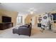 Spacious bonus room with comfortable seating, television, carpeted floor and fitness equipment at 836 Canyoncreek Ln, Fuquay Varina, NC 27526