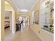 Spacious hallway featuring tile flooring, decorative wall niches, and a view into the living areas at 836 Canyoncreek Ln, Fuquay Varina, NC 27526