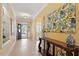 Elegant hallway with tile floors, decorative lighting, console table, and an arched doorway at 836 Canyoncreek Ln, Fuquay Varina, NC 27526