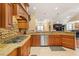Stylish kitchen with stone backsplash, granite countertops, stainless steel appliances, and an open layout at 836 Canyoncreek Ln, Fuquay Varina, NC 27526