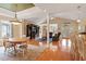 Open-concept living space with wood floors, large entertainment center, and views into other rooms at 836 Canyoncreek Ln, Fuquay Varina, NC 27526