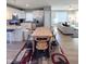 Open-concept kitchen and dining area with modern appliances and stylish seating arrangements at 103 1St St, Haw River, NC 27258