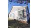 Exterior shot showcasing the home's siding, windows with black shutters, and clean design at 103 1St St, Haw River, NC 27258