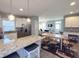 Open-concept kitchen flowing into the dining and living areas, great for entertaining at 103 1St St, Haw River, NC 27258
