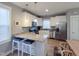 Bright kitchen features granite countertops, stainless steel appliances, and pendant lighting at 103 1St St, Haw River, NC 27258